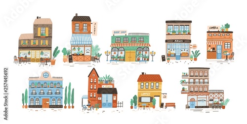 Collection of stores, shops, cafe, restaurant, bakery, coffee house isolated on white background. Bundle of buildings on street of European city. Flat vector illustration in cute naive style. © Good Studio