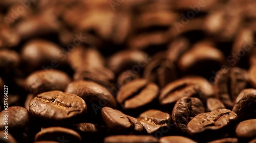 Roasted brown coffee beans as background. Close up © Voyagerix