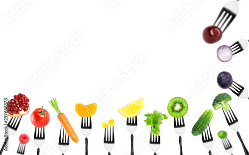 Fruits and vegetables on the forks © seralex