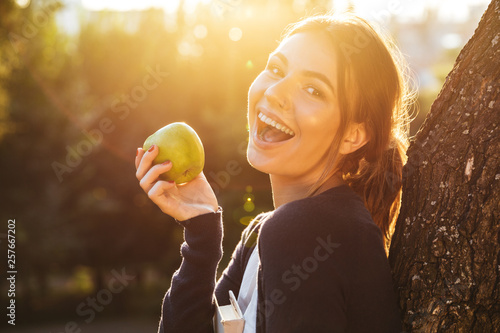 Beautiful young girl holding apple © Drobot Dean