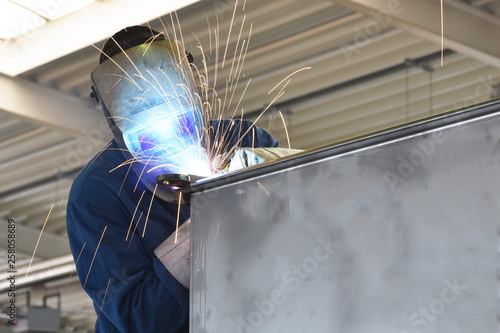 welder works in metal construction - construction and processing of steel components © industrieblick