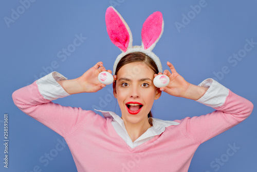 Lipstick kiss print on easter egg. Lips and Easter, Lipstick kiss imprint on easter egg. Happy easter. Portrait of a happy woman in bunny ears. Egg hunt.