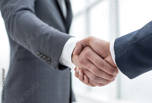 close up.handshake business partners. © ASDF