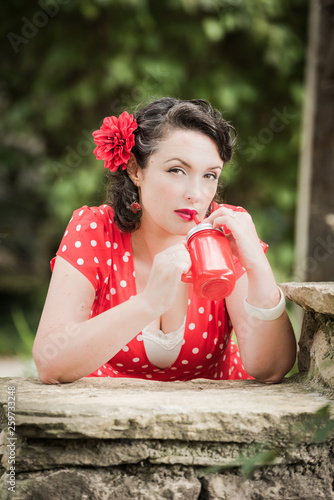 beautiful vintage woman in red dress, rockabilly style © Sokarys
