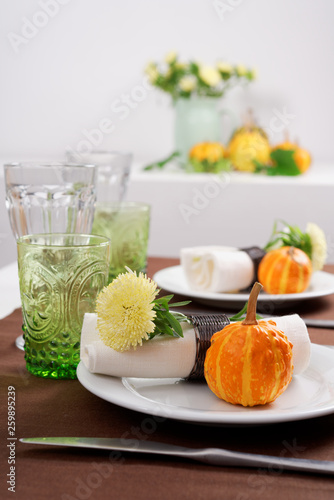 Thanksgiving table setting with decorative pumpkins © StockphotoVideo