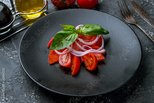 Tomato salad with red onion © bbivirys