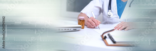 Female doctor writing prescription. panoramic banner © thodonal