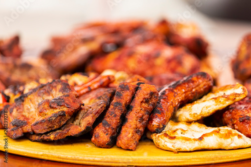 close up of mix grill served on a plate, selective focus