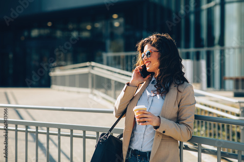 Young business woman talking on the phone in the city © djile