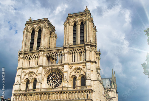 Notre Dame exterior view against a cloudy sky, Paris © jovannig