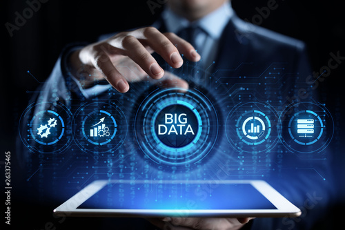 Big data analytics technology internet technology concept. Businessman pressing button on virtual screen. © Murrstock