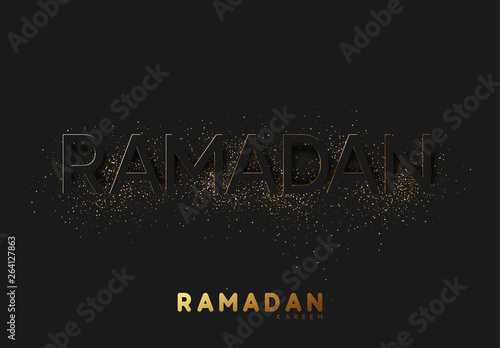Ramadan Kareem black background with embossment text sprinkled with golden shiny powder of dust and sand. © lauritta