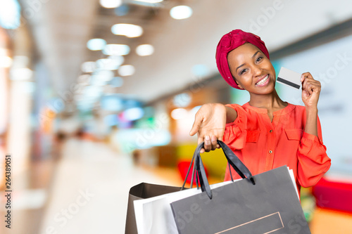 Beautiful woman doing shopping and holding bags © fotofabrika